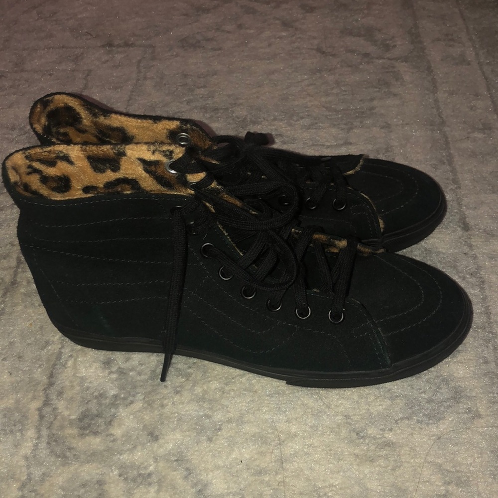 All black high top Vans with leopard interior